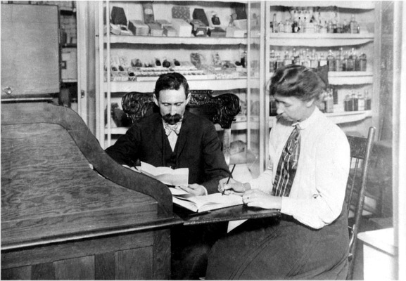 George  J. McConnell at Desk with Secretary